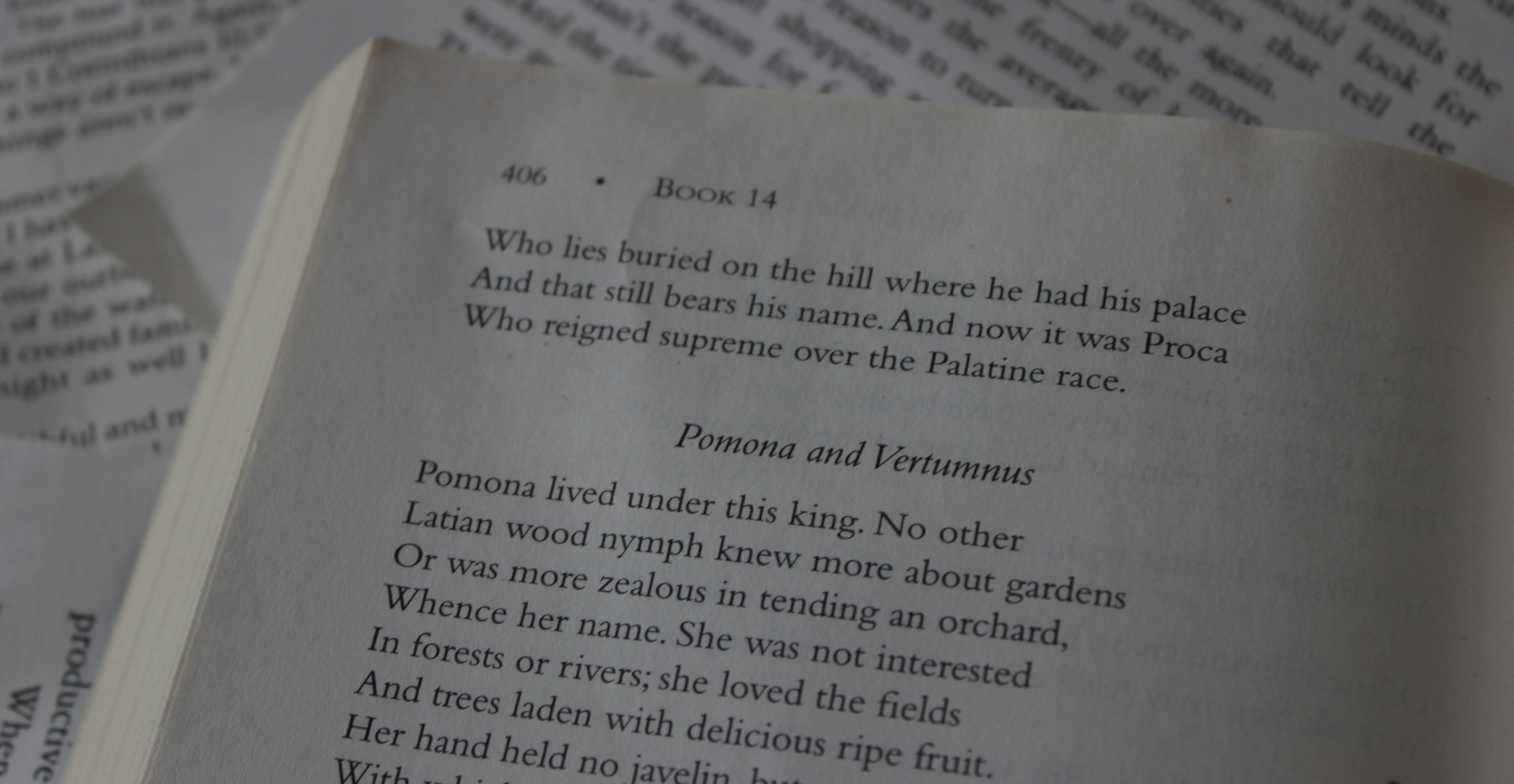 Photograph of an open book against a background of other book pages. The book is an English translation of Ovid's Metamorphoses, and the heading near the top reads "Pomona and Vertumnus." The image is for display purposes to add interest to the post, and the rest of the text in the photo is not relevant.